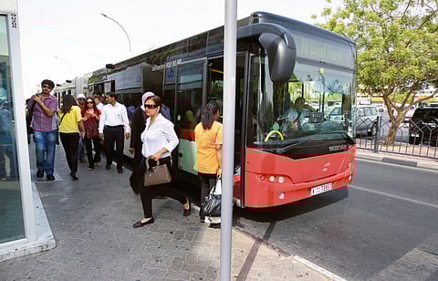 Commuters disembark from an RTA bus at Al Satwa.