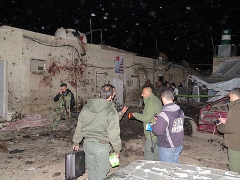 Syrian soldiers gather at the site of an attack in Kafr Sousa, southwest of the Syrian capital Damascus. Illustrative image.