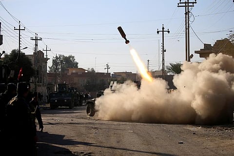 Members of the Iraqi rapid response forces fire a missile toward Daeh militants during a battle in Somer district of eastern Mosul, Iraq.