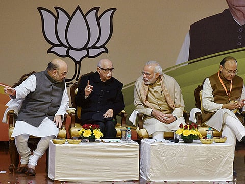 Prime Minister Narendra Modi with BJP President Amit Shah and senior party leader LK Advani and Arun Jaitley at the party's National Executive Meeting in New Delhi on Friday.