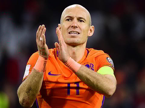 Arjen Robben acknowledges the fans in Dutch colours.