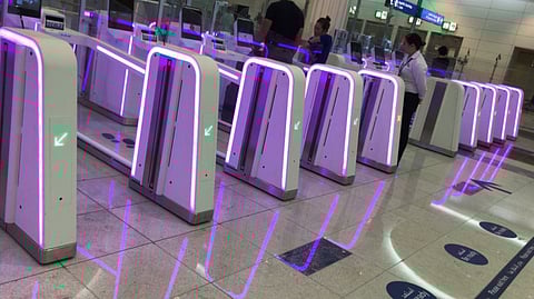 Smart Gates at Dubai airport illuminated in pink