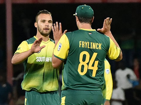 Dane Paterson of South Africa, left.