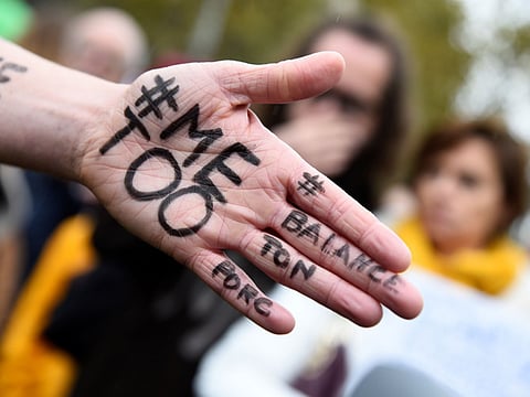 A picture shows the message "Me too" on the hand of a protester during a gathering against gender-based and sexual violence called by the Effronte-e-s Collective, on the Place de la Republique square in Paris on October 29, 2017. #MeToo hashtag, is the campaign encouraging women to denounce experiences of sexual abuse that has swept across social media in the wake of the wave of allegations targeting Hollywood producer Harvey Weinstein. / AFP / Bertrand GUAY