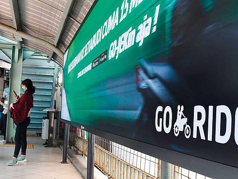 An advertisement for motorbike on-demand service Go-Jek at a railway station in Jakarta. With a population of more than 250 million, a swelling middle class and growing availability of cheap mobile devices, firms from across the world are flocking to Indonesia.