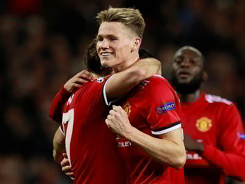 Manchester United's Scott McTominay (right) with Daley Blind after scoring a goal during the season.