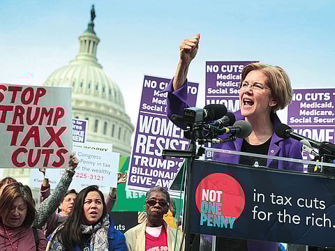 Sen. Elizabeth Warren (D-MA) addresses a rally against the Republican tax plan outside the US Capitol in Washington, DC