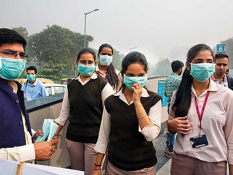 Volunteers distribute face masks in New Delhi (File)