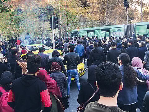 Demonstrators fill the streets of Tehran on Saturday. A wave of spontaneous protests over Iran’s weak economy swept into Tehran with college students and others chanting against the government just hours after hardliners held their own support rally.