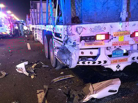 2 brothers killed as vehicle crashes into trucks