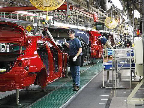 Toyota Camrys on the production line in Georgetown, Kentucky. Toyota Motor Corp. grabbed the US sales crown from General Motors Co., swiping an honor that the Detroit automaker has held since 1931.