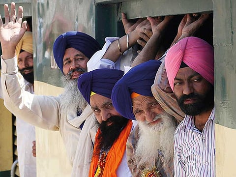 Indian Sikhs arrive at Wagah railway station near Lahore in April, 2019.