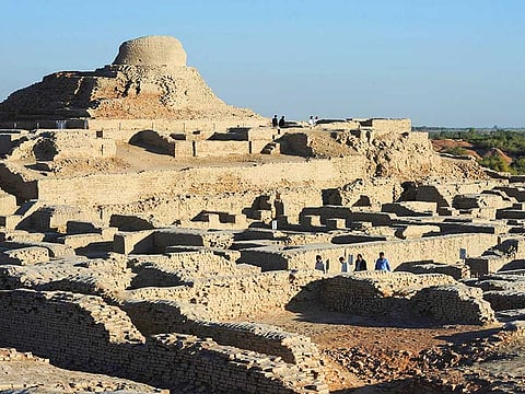 Visitors walk through the UNESCO World Heritage archeological site of Mohenjo Daro.