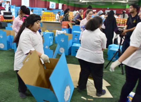 Special needs students pack Ramadan boxes for families