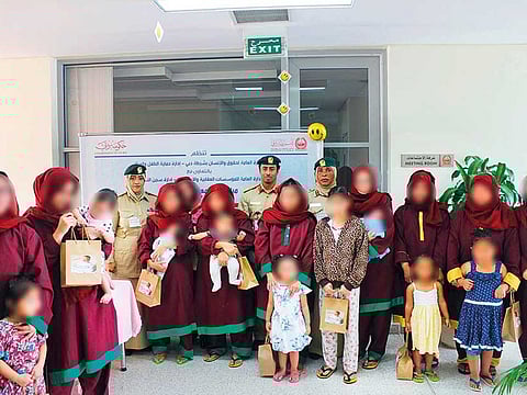 Dubai Police officials with children of female prisoners at the Dubai women’s prison at Al Aweer.