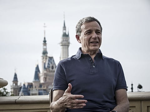Bob Iger, chief executive officer of Walt Disney Co., speaks during a Bloomberg Television interview at Disneyland in Shanghai, China, on Friday, June 16, 2017. Iger said he stepped down from Donald Trump's jobs panel two weeks ago following the president's decision to exit the Paris Accord on climate change because businesses must accept responsibility to protect the environment. Photographer: Qilai Shen/Bloomberg
