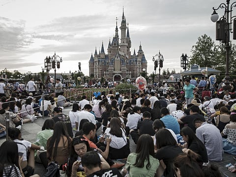 A blast from the past... Thronging the Disneyland theme park in Shanghai. The operator is reopening the attraction on May 11, but on a limited entry basis.