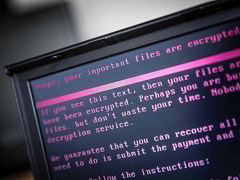 A laptop displays a message after being infected by a ransomware as part of a worldwide cyberattack.