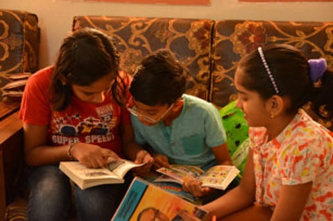 Reading club encouraging children to pick up books