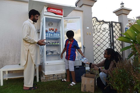 Emirati woman sets up fridge at her Abu Dhabi home