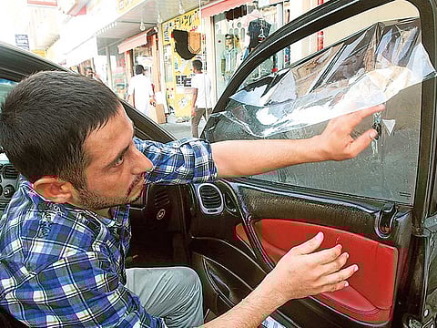 The car-tinting business is lucrative in summer as car owners opt for ways to reduce the heat.