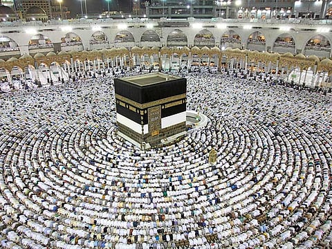 Muslim worshipers perform the evening (Isha) prayers at the Kaaba, Islam's holiest shrine, at the Grand Mosque in Saudi Arabia's holy city of Mecca on August 25, 2017, a week prior to the start of the annual Haj pilgrimage in the holy city.