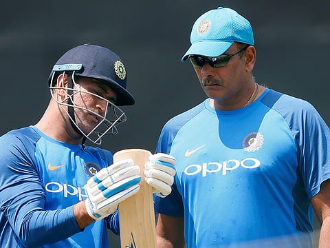 Indian head coach Ravi Shastri is all ears to Mahendra Singh Dhoni ahead of one their contests a few years back.