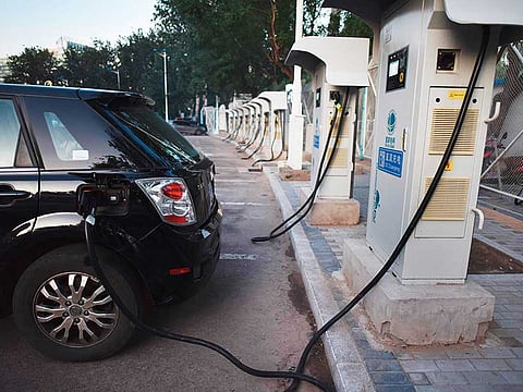 An electric car at a charging station. Israeli company StoreDot Ltd. has manufactured the first battery for electric vehicles that can be charged in just five minutes.