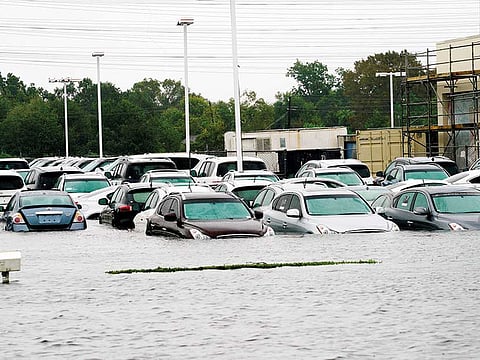 A car dealership is inundated by Hurricane Harvey floodwaters near Houston, Texas, US. Investors in “cat bonds” — or catastrophe bonds — may find themselves in financial straits after insurers tot up their losses from ther recent hurricanes there.