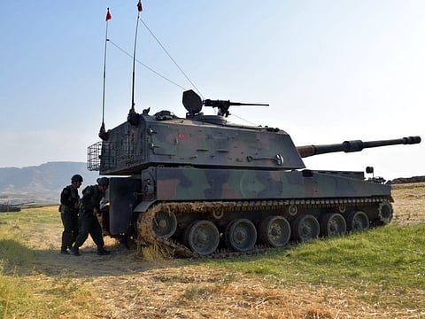 Turkish soldiers take part in a military drill close to the Habur border gate with Iraq.
