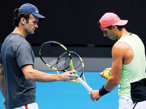 Coach Carlos Moya (left) will be monitoring Rafa Nadal's progress in Australian Open from home this year.