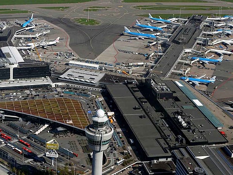 Passenger caps will again be introduced at Amsterdam's Schiphol Airport in April and May as it continues its recruitment drive.