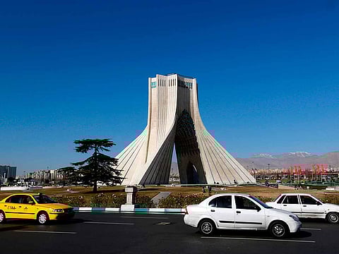 Iranian motorists drive past the Azadi Tower in the capital Tehran. The minister revealed that his ministry had proposed visa free for 60 countries, but the government approved the measure for 33 of them.