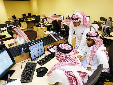 Traders at the Tadawul All Share Index in Riyadh.