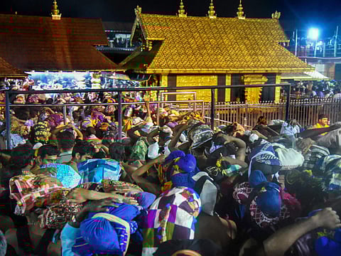 Devotees arrive to pay obeisance at Lord Ayyappa Temple in Sabarimala, Thursday, October 18, 2018.