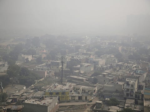 Morning haze envelops the skyline on the outskirts of New Delhi, India, Wednesday, October 24, 2018.