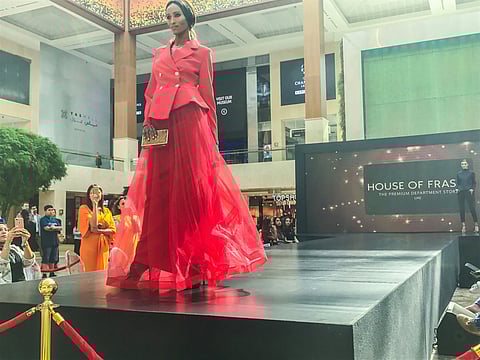 A model walking the ramp during the Modest Fashion Weekend at Yas Mall, Abu Dhabi.