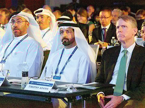 From left: Ahmad Al Sayegh, Minister of State and chairman of the Abu Dhabi Global Market, Mubarak Rashed Al Mansouri, UAE Central Bank governor, and Tim Adams, president and CEO of the IIF, at the 2018 IIF Mena Financial Summit on Al Maryah Island, Abu Dhabi, on Tuesday.