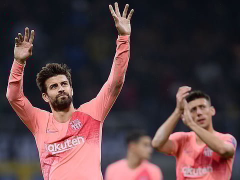 Barcelona's Spanish defender Gerard Pique acknowledges the crowd.