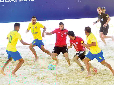 Egypt in action against Brazil (in yellow) during the Huawei Intercontinental Beach Soccer Cup on Wednesday. Brazil won 10-5.