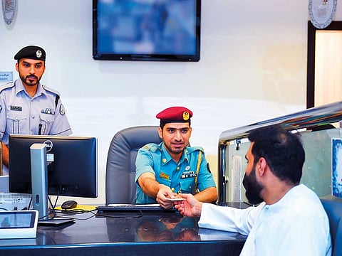 Sharjah Police return a missing digital camera to a visitor.