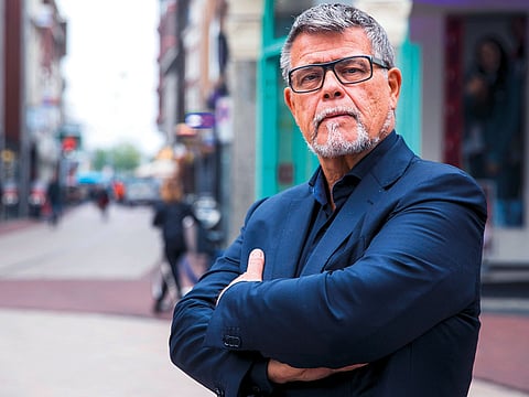 This photo taken on November 5, 2018 shows s portrait of a 69-year-old Dutchman Emile Ratelband in the centre of Arnhem, The Netherlands. Emile Ratelband wants his official age (69) to be adjusted with his 'emotional age' (49).