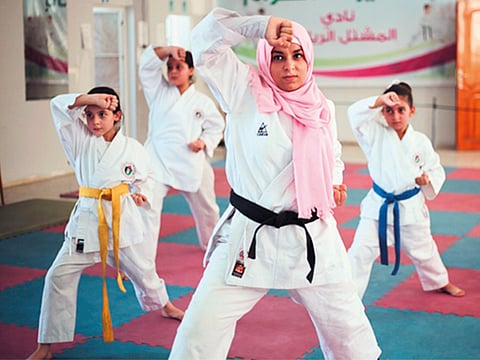 Bessan Al Khairye, who started teaching karate to girls at the age of 21 with five students.