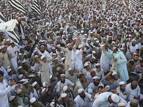 Supporters of Pakistani religious parties coalition Muttahida Majlis-e-Amal Alliance rally against the acquittal of Pakistani Christian woman Asia Bibi, in Karachi, Pakistan, Thursday, Nov. 8, 2018. A Christian woman acquitted after eight years on death row in Pakistan for blasphemy was released but her whereabouts in Islamabad on Thursday remained a closely guarded secret in the wake of demands by radical Islamists that she be publicly executed. (AP Photo/Fareed Khan)
