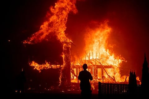 A home burns as the Camp Fire rages through Paradise, California.