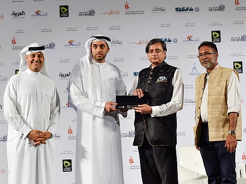 Dr Rashid Al Nuaimi, Executive Director at the National Media Council, presenting a memento to former Indian Minister of Foreign Affairs, Shashi Tharoor in presence of Ibrahim Khadijah and Shajahan Madampat during an Interactive session on India UAE ties at Sharjah International Book Fair.