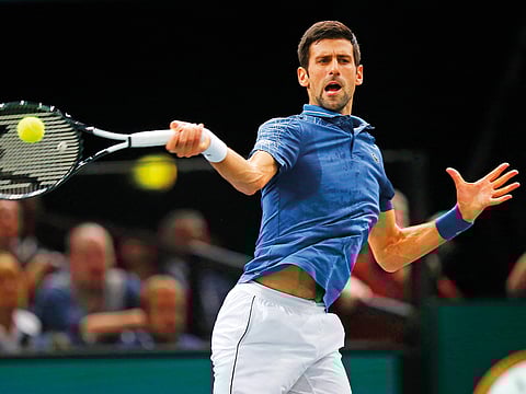 Novak Djokovic returns the ball to Karen Khachanov of Russia during their final match of the Paris Masters tennis tournament at the Bercy Arena in Paris, on November 4, 2018.