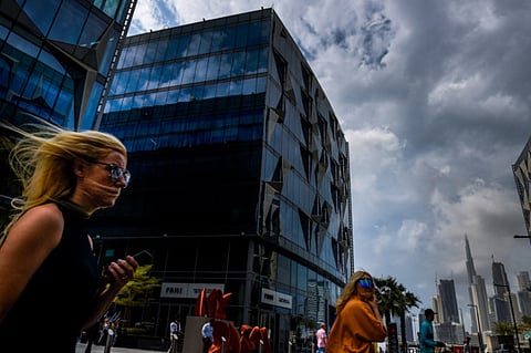 People at Dubai Design District during the cloudy weather in Dubai. For illustrative purposes only.