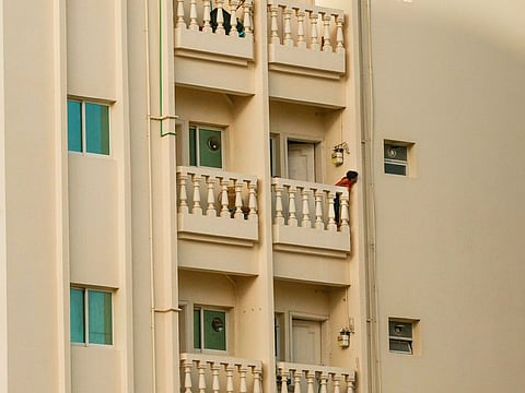 A kid at the balcony of their flat in Sharjah. For illustrative purposes only