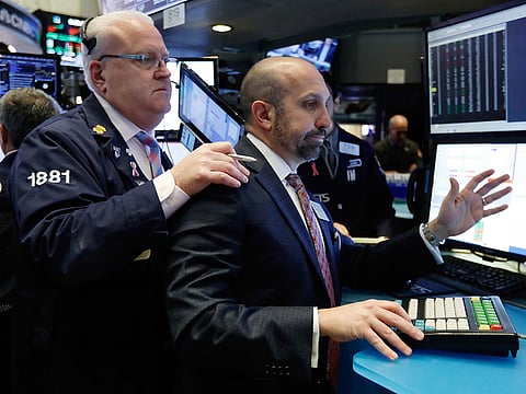 Traders work on the floor of the New York Stock Exchange, on Wednesday, November 14, 2018.